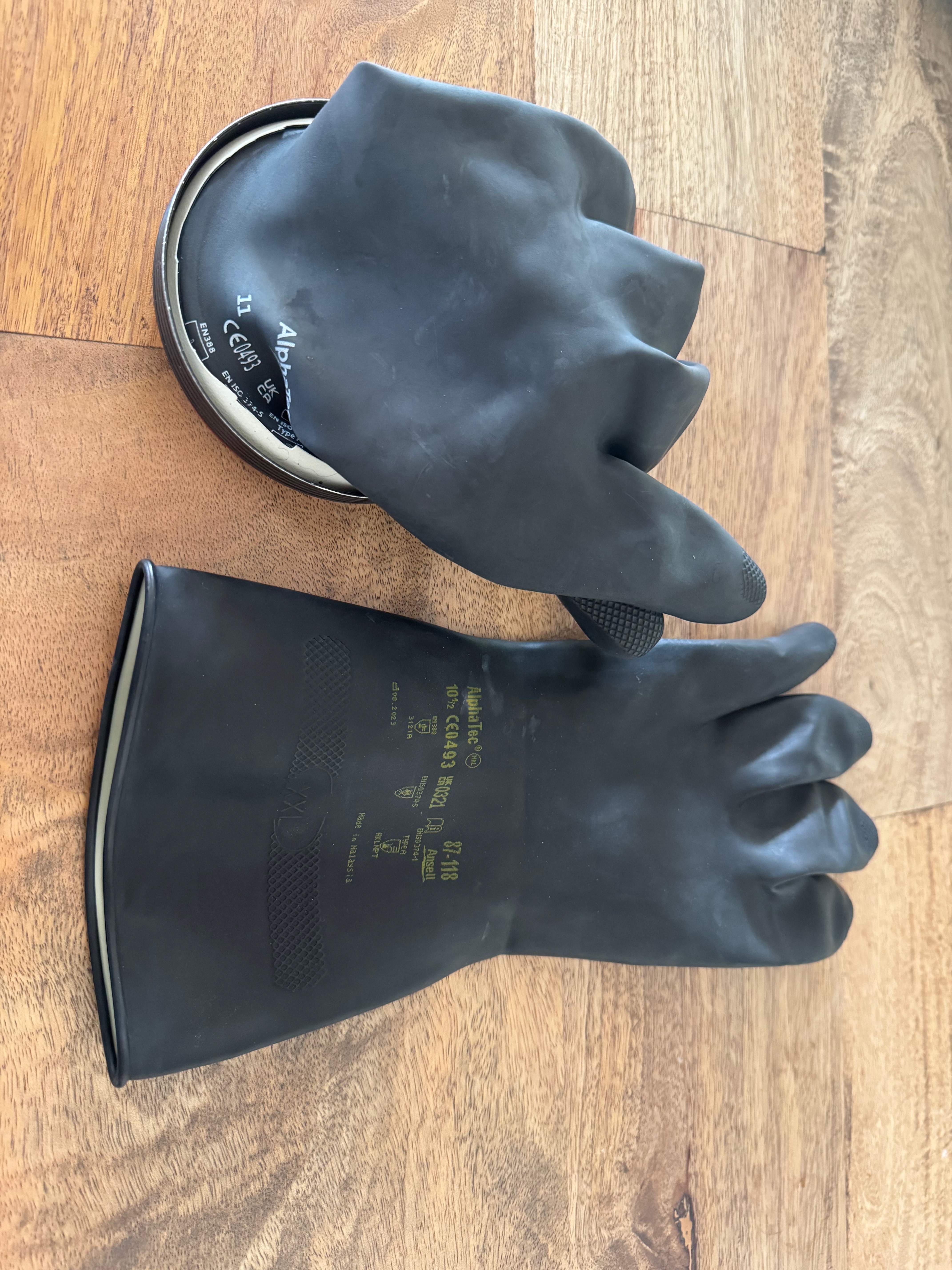 Old Kubi glove still on the ring alongside a new AlphaTec replacement glove