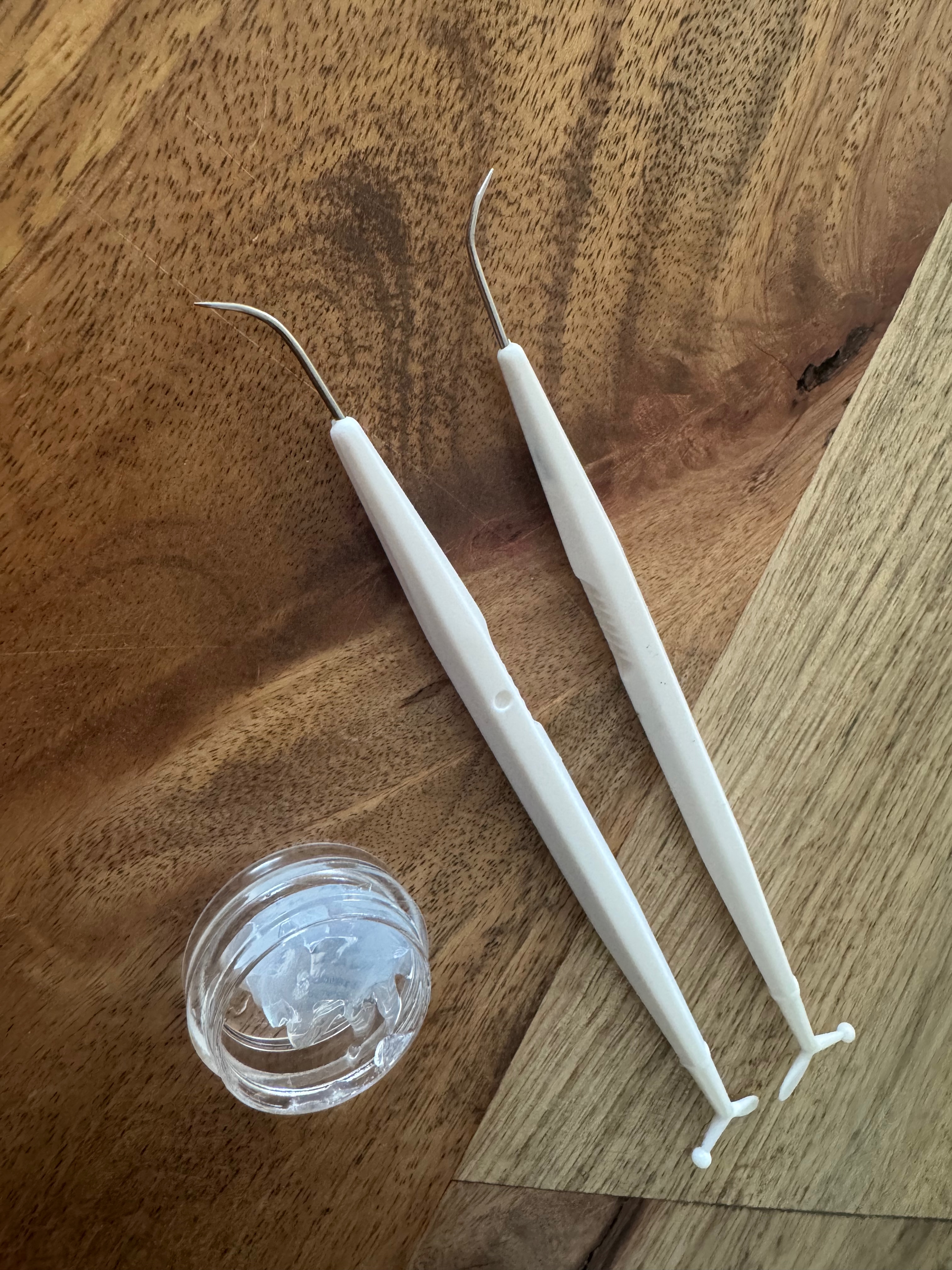 O-ring pick, dental floss tool, and a small pot of silicone grease on a workbench